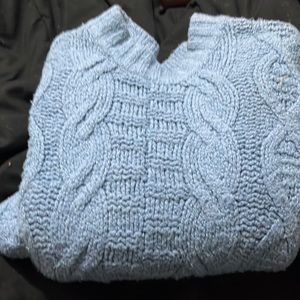 This is a blue sweater it’s barely been worn I have a lot more to sell.
